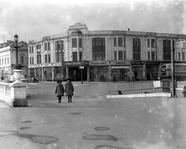 The entrance to the Arcade and other shops on the promenade on Worthing seafront. 1926