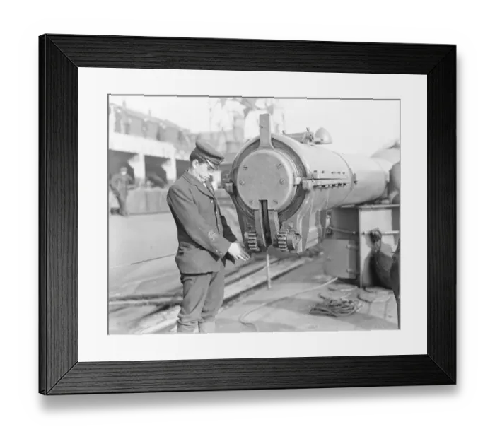 Framed Print : HMS Submarine No 3 One of the crew inspecting the hydraulic water tight cap that Framed Print : HMS Submarine No 3 One of the crew inspecting the hydraulic water tight cap that
