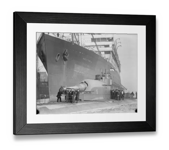 Framed Print : HMS Submarine No 3 The new submersible battleship, lying alongside the giant Cunarder Framed Print : HMS Submarine No 3 The new submersible battleship, lying alongside the giant Cunarder