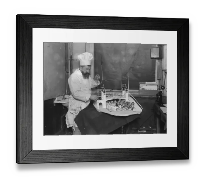 Framed Print : Mr Cantelupe, The Criterion chef, At work on his model of the boat race 23 March 1923 Framed Print : Mr Cantelupe, The Criterion chef, At work on his model of the boat race 23 March 1923