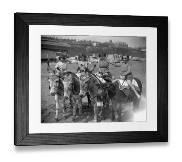 Framed Print : Donkeys on the sands at Ramsgate beach with their happy young riders. 22 May 1926