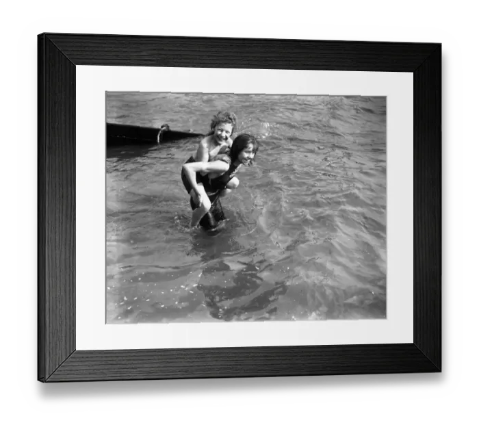 Framed Print : Young holiday makers enjoy a pick- a - back in the sea at Southend. 6 April 1920