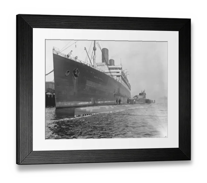 Framed Print : HMS Submarine No 3 The new submersible battleship lying alongside the giant Cunarder Framed Print : HMS Submarine No 3 The new submersible battleship lying alongside the giant Cunarder