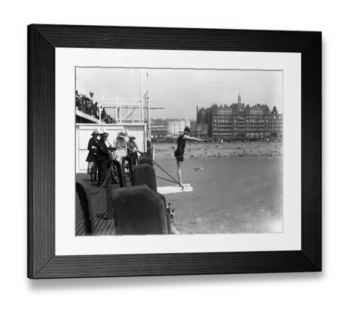 Framed Print : Diving off the pier during the Whitsun holiday at Brighton. 1920 Framed Print : Diving off the pier during the Whitsun holiday at Brighton. 1920