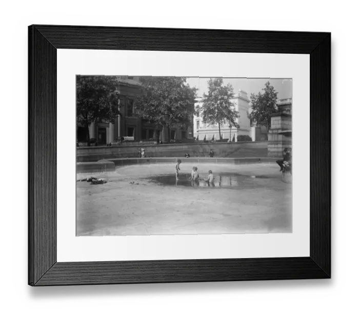 Framed Print : Rain Gods gift to little Londoners. Children bathing in a pool in the empty basins Framed Print : Rain Gods gift to little Londoners. Children bathing in a pool in the empty basins
