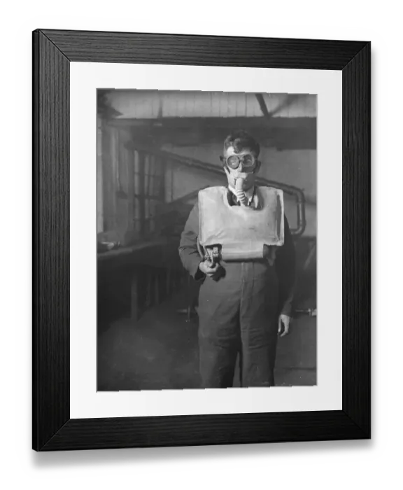 Framed Print : Mr R H Davis, managing director of Siebe, Gohman and Co, with the new apparatus