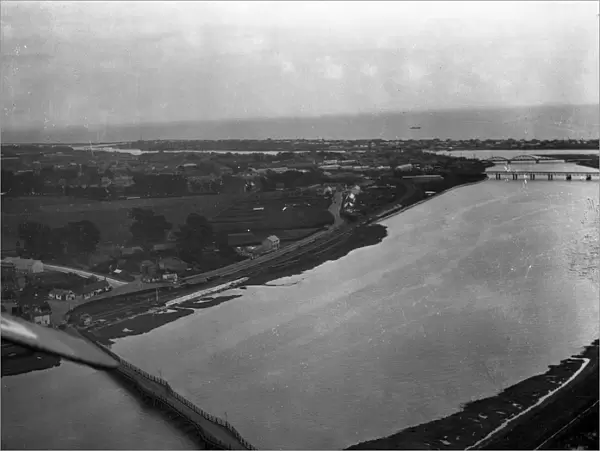 A view of Shoreham - by - Sea from the air showing the bridges over the River Adur