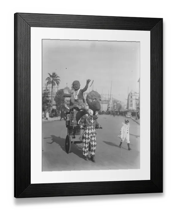 Framed Print : King Carnival at Nice. A big head and his passenger in the procession Framed Print : King Carnival at Nice. A big head and his passenger in the procession