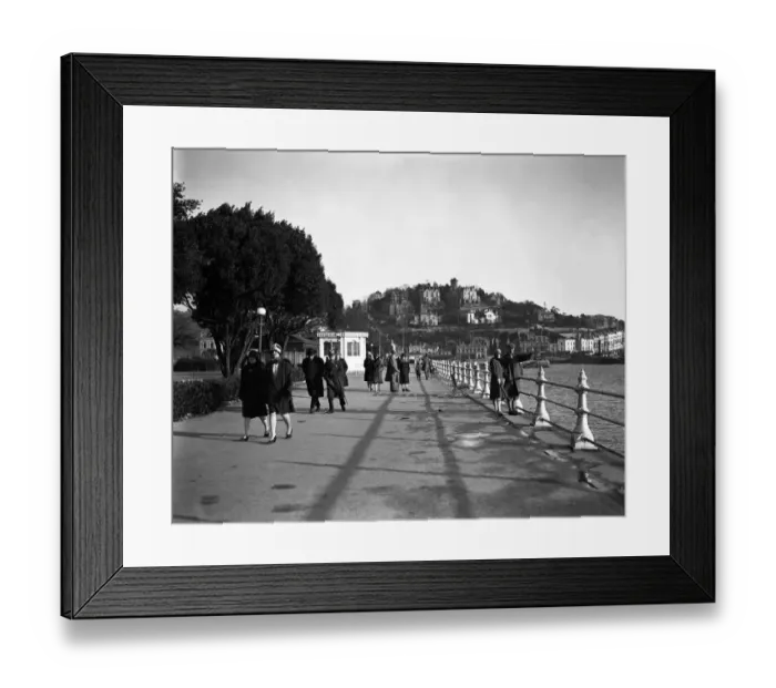 Framed Print : Walking along The Promenade, Torquay, Devon. 1 February 1928 Framed Print : Walking along The Promenade, Torquay, Devon. 1 February 1928