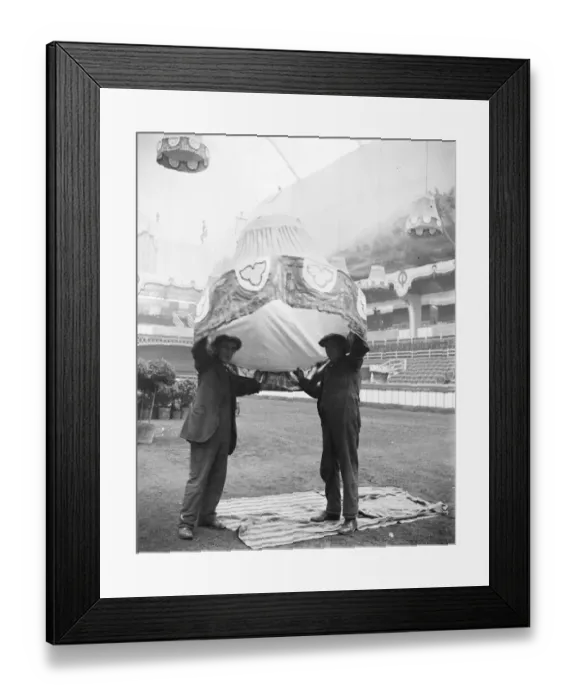 Framed Print : Not an Ascot Hat. Preparing for the International Horse Show at Olympia Two workmen