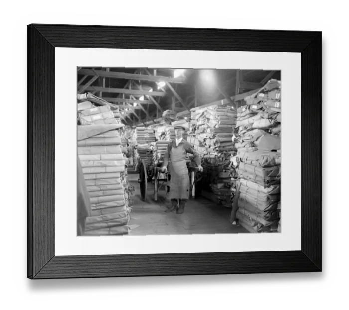 Framed Print : At Messrs James Burns Book Binding works at Esher. The quire warehouse, where Framed Print : At Messrs James Burns Book Binding works at Esher. The quire warehouse, where