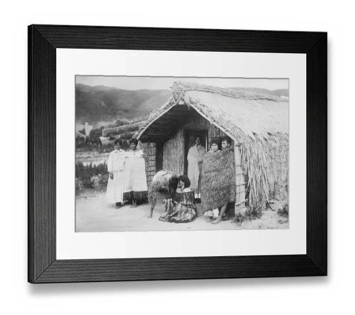 Framed Print : New Zealand. A typical Maori home. The two figures in the centre of the group Framed Print : New Zealand. A typical Maori home. The two figures in the centre of the group