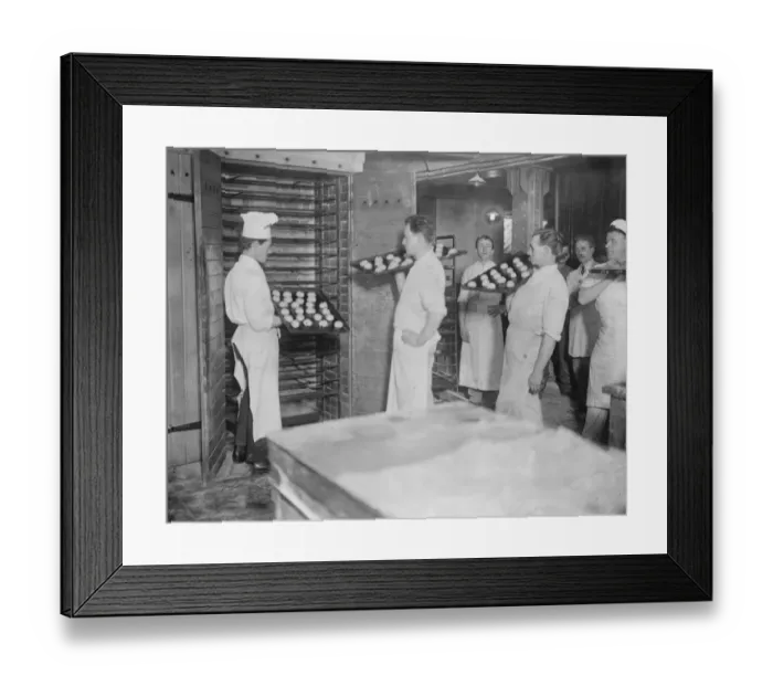 Framed Print : The making of hot cross buns at R E Jones Ltd Into the oven 28 March 1923