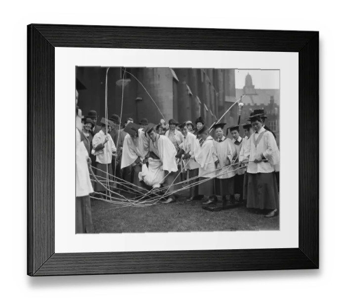 Framed Print : Beating the bounds of St Clement Danes. One of the choirboys being bumped Framed Print : Beating the bounds of St Clement Danes. One of the choirboys being bumped