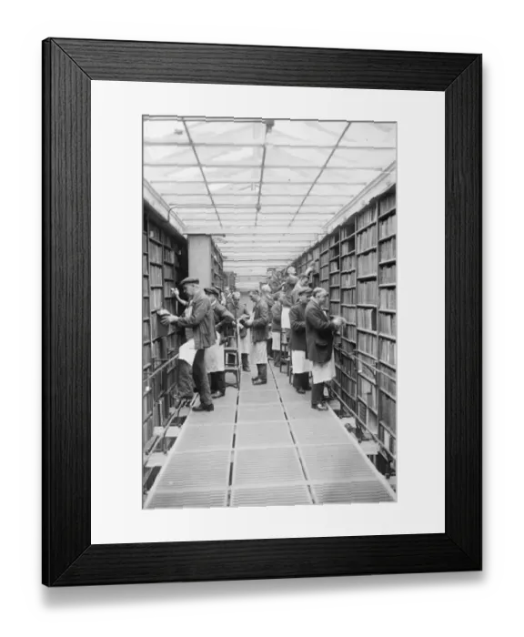 Framed Print : The gentlemen with the dusters. Millions of books being overhauled at the British Framed Print : The gentlemen with the dusters. Millions of books being overhauled at the British
