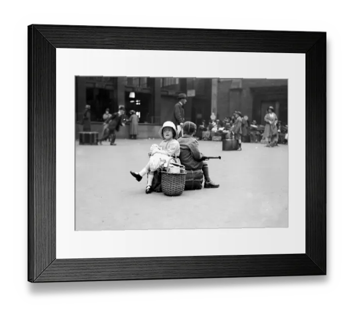 Framed Print : August Bank Holiday scenes-Waterloo Station - Waiting while daddy gets the tickets Framed Print : August Bank Holiday scenes-Waterloo Station - Waiting while daddy gets the tickets