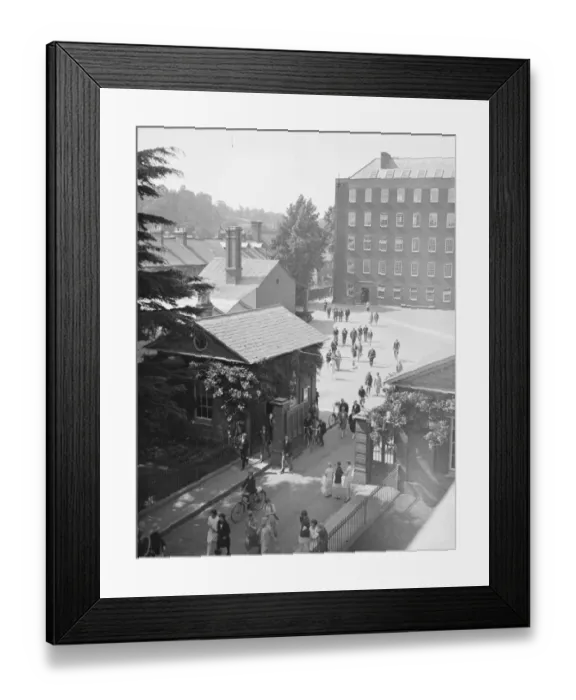 Framed Print : Employees Leaving the works of Messrs Heathcoat and Co at Tiverton. 15 July 1929 Framed Print : Employees Leaving the works of Messrs Heathcoat and Co at Tiverton. 15 July 1929