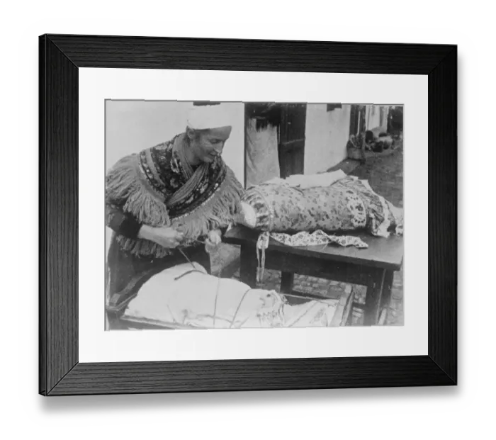 Framed Print : Mesokovesd, Hungary. Babies are tied in their cradles in Hungary. The mother unties Framed Print : Mesokovesd, Hungary. Babies are tied in their cradles in Hungary. The mother unties