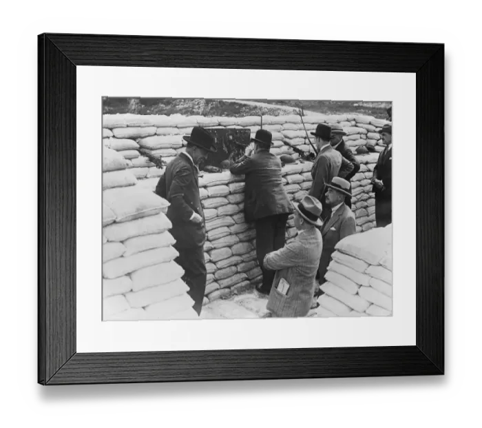 Framed Print : The Prime Minister in the trenches. Mr Stanley Baldwin handles a machine gun during Framed Print : The Prime Minister in the trenches. Mr Stanley Baldwin handles a machine gun during