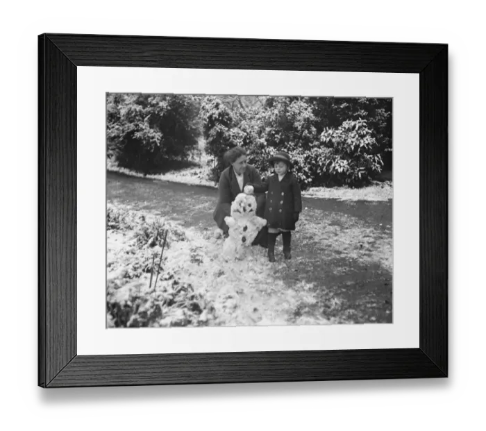 Framed Print : Viscount Cranley, Lord Onslows son, makes effigy of the Kaiser in snow at Clandon Park Framed Print : Viscount Cranley, Lord Onslows son, makes effigy of the Kaiser in snow at Clandon Park