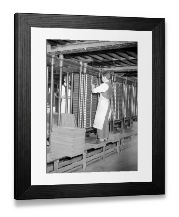 Framed Print : At Messrs James Burns Book Binding works at Esher. Hydraulic pressers in the gluing department Framed Print : At Messrs James Burns Book Binding works at Esher. Hydraulic pressers in the gluing department