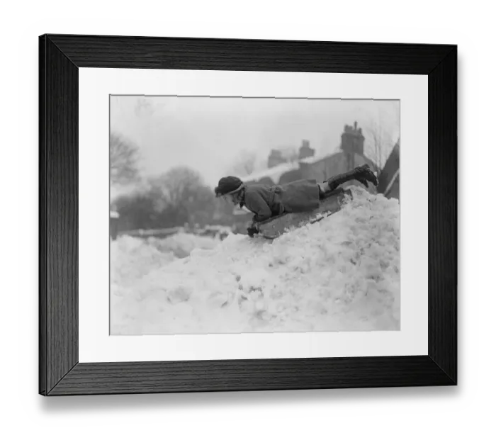 Framed Print : Englands winter sports in full swing. The tobogganning girl at the start of Framed Print : Englands winter sports in full swing. The tobogganning girl at the start of