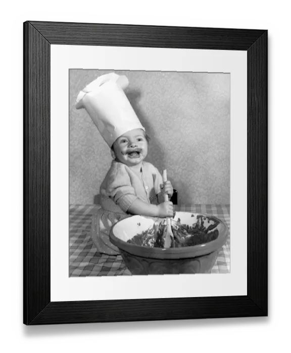 Framed Print : Eight months old Peter Raven of Bishops Stortford takes a hand in the mixing of Framed Print : Eight months old Peter Raven of Bishops Stortford takes a hand in the mixing of