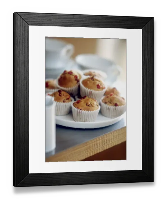 Framed Print : Plate of muffins in paper cases in teatime setting credit: Marie-Louise Avery / Framed Print : Plate of muffins in paper cases in teatime setting credit: Marie-Louise Avery /