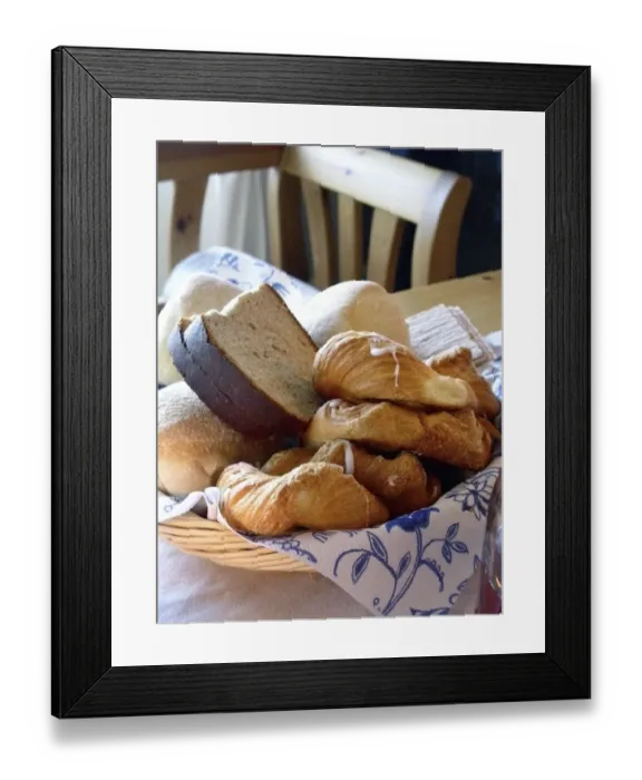 Framed Print : A collection of various breads and pastries in basket on table. Sweden credit