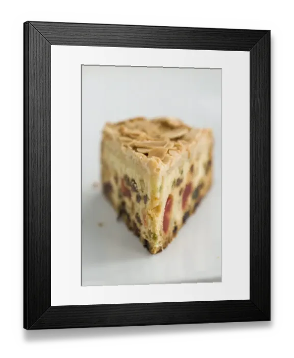 Framed Print : Slice of light fruitcake with sultanas, candied peel and glace cherries credit