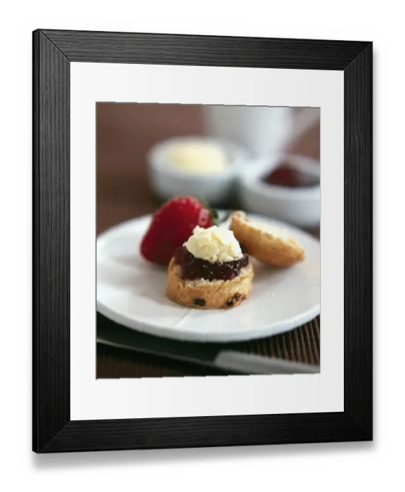Framed Print : Classic scone with clotted cream and jam with fresh strawberry served with afernoon tea credit