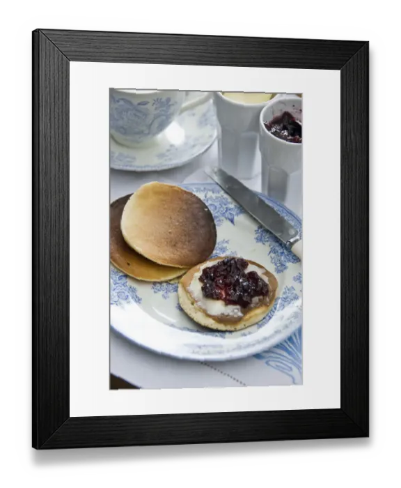 Framed Print : Teatime setting with scotch pancakes and raspberry jam credit: Marie-Louise Avery Framed Print : Teatime setting with scotch pancakes and raspberry jam credit: Marie-Louise Avery