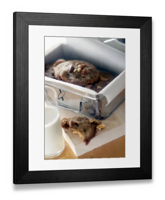 Framed Print : Chocolate nut cookies in paper lined storage tin credit: Marie-Louise Avery / thePictureKitchen Framed Print : Chocolate nut cookies in paper lined storage tin credit: Marie-Louise Avery / thePictureKitchen