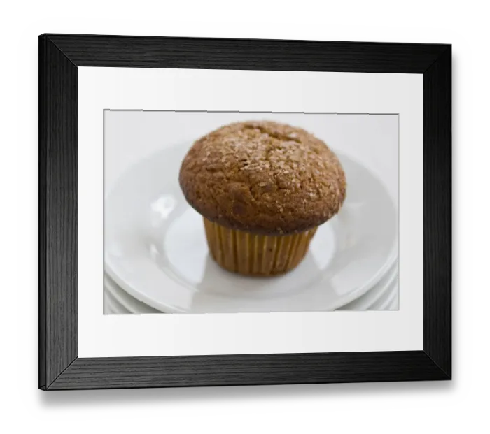 Framed Print : Cinnamon bran muffin on stack of white plates with cup of black coffee credit Framed Print : Cinnamon bran muffin on stack of white plates with cup of black coffee credit