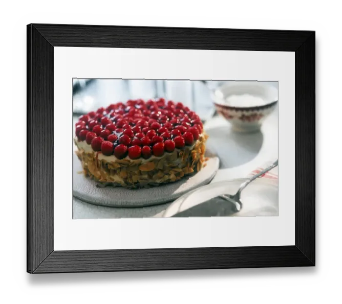 Framed Print : Celebration cream cake toppped with fresh raspberries and with toasted flaked almonds Framed Print : Celebration cream cake toppped with fresh raspberries and with toasted flaked almonds