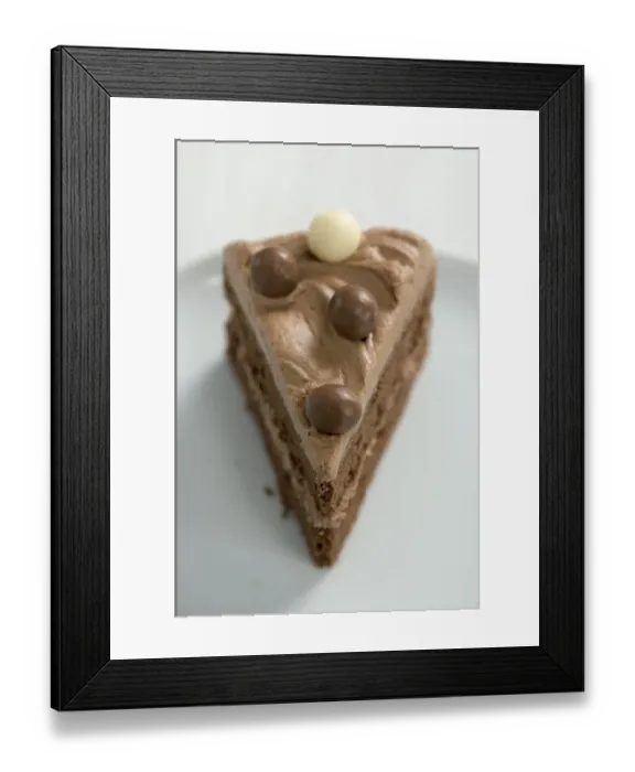 Framed Print : Single slice of rich chocolate cake layered with chocolate butter cream credit Framed Print : Single slice of rich chocolate cake layered with chocolate butter cream credit