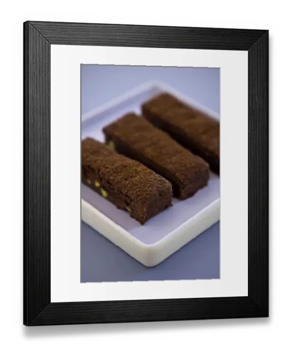 Framed Print : Three chocolate tray bake slices dusted with cocoa powder on square mauve plate credit Framed Print : Three chocolate tray bake slices dusted with cocoa powder on square mauve plate credit