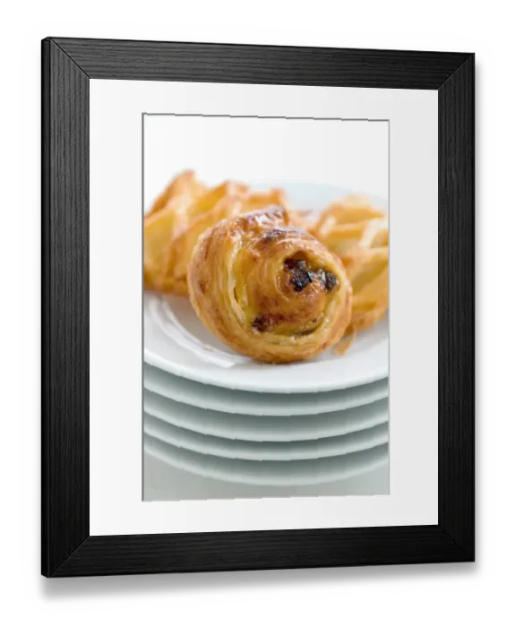 Framed Print : Small danish pastries on stack of white plates credit: Marie-Louise Avery  /  thePictureKitchen