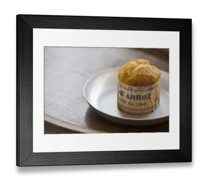 Framed Print : Classic Portuguese muffin type cake made with rice in paper wrapper on metal plate Framed Print : Classic Portuguese muffin type cake made with rice in paper wrapper on metal plate
