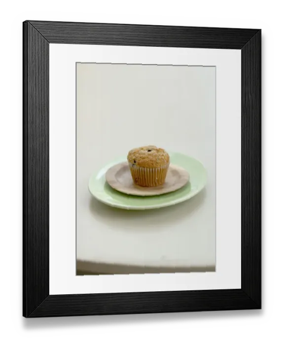 Framed Print : Healthy bran and raisin muffin on small wooden plate on green platter credit: Marie-Louise Framed Print : Healthy bran and raisin muffin on small wooden plate on green platter credit: Marie-Louise