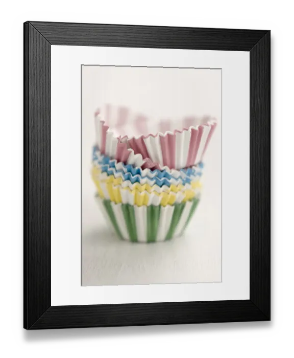 Framed Print : Stack of candy striped muffins cases credit: Marie-Louise Avery / thePictureKitchen Framed Print : Stack of candy striped muffins cases credit: Marie-Louise Avery / thePictureKitchen