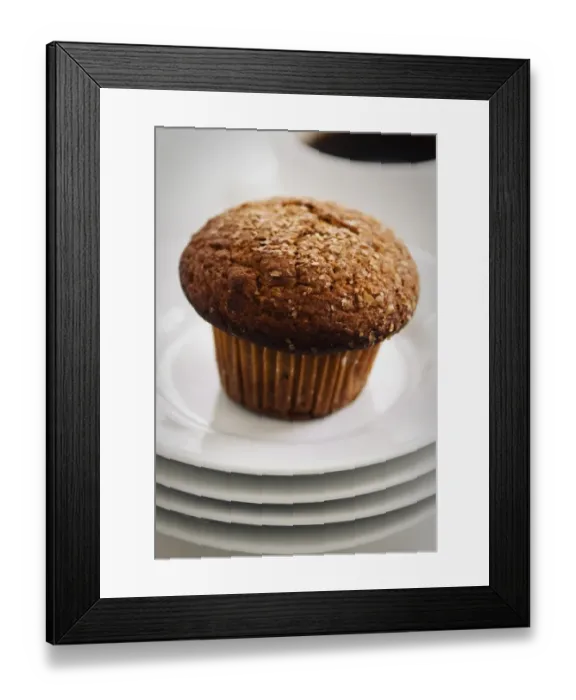 Framed Print : Cinnamon bran muffin on stack of white plates with cup of black coffee credit Framed Print : Cinnamon bran muffin on stack of white plates with cup of black coffee credit