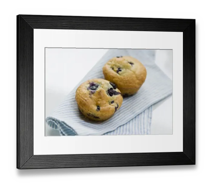 Framed Print : Freshly baked blueberry muffin on blue striped napkin. credit: Marie-Louise Avery Framed Print : Freshly baked blueberry muffin on blue striped napkin. credit: Marie-Louise Avery
