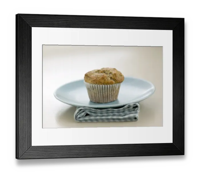 Framed Print : Single poppyseed muffin on blue plate on check napkin, on painted table. credit