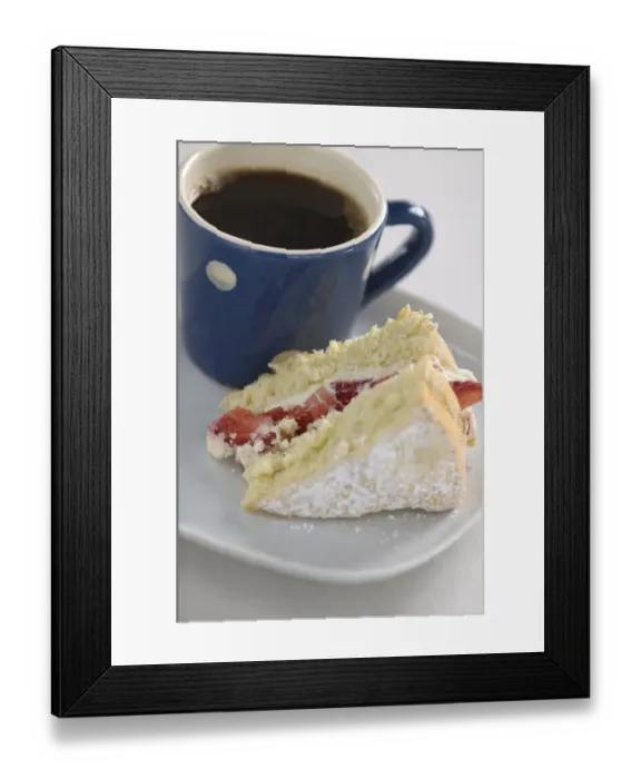 Framed Print : A piece of strawberry sponge cake on a white plate with a small blue and white spotted Framed Print : A piece of strawberry sponge cake on a white plate with a small blue and white spotted