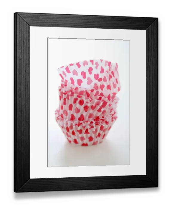 Framed Print : Paper cases for making muffins and fairy cakes - decorated with small red hearts credit Framed Print : Paper cases for making muffins and fairy cakes - decorated with small red hearts credit