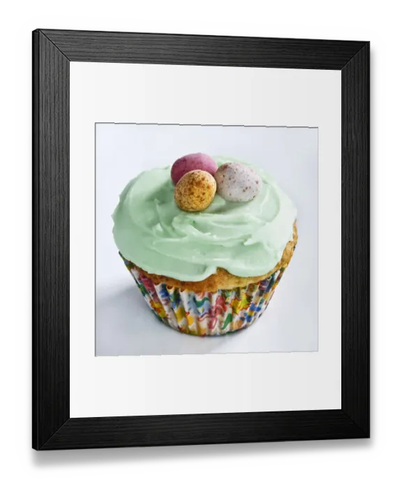 Framed Print : Iced Easter cupcake with chocolate mini eggs credit: Marie-Louise Avery / thePictureKitchen Framed Print : Iced Easter cupcake with chocolate mini eggs credit: Marie-Louise Avery / thePictureKitchen