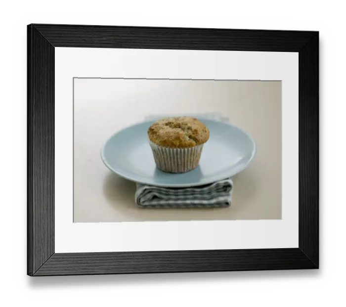 Framed Print : Single poppyseed muffin on blue plate on check napkin, on painted table. credit Framed Print : Single poppyseed muffin on blue plate on check napkin, on painted table. credit