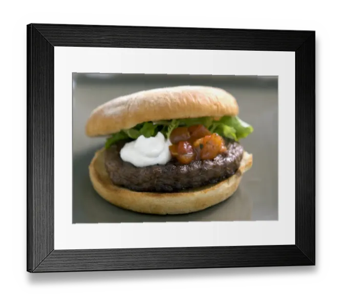 Framed Print : Chargrilled hamburger in bun with frisee salad, tomato salsa and sour cream credit