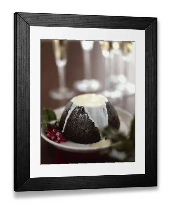 Framed Print : Traditional British Christmas pudding with thin cream or custard poured over Framed Print : Traditional British Christmas pudding with thin cream or custard poured over